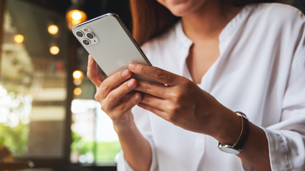 Woman in Chiang Mai, Thailand keeping and using iPhone 11 Pro Max on June 19th 2020