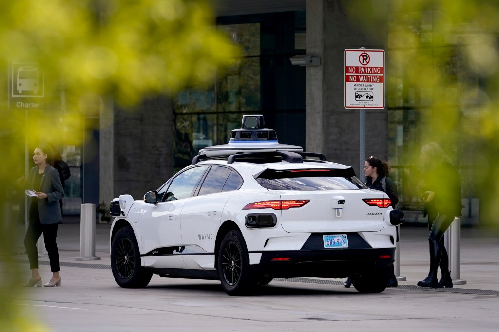 Waymo's self-driving vehicle sits at the expense.